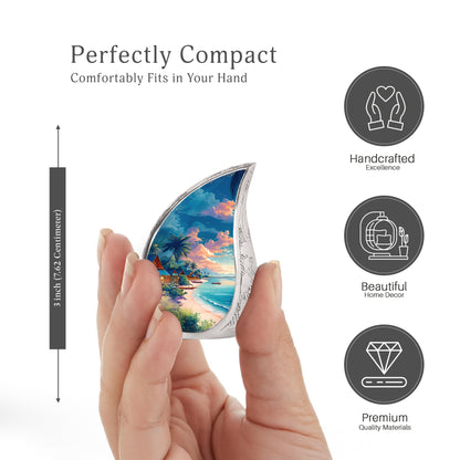 Sapphire Blue Beach Cremation Urn angled view of lid and engraved motif - smooth teardrop contour featuring beach art - mini keepsake memorial for portion of cremation ashes
