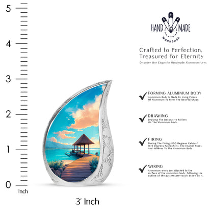 Sea Green Teal Beach Cremation Urn angled view of lid and engraved motif - flowing teardrop beach silhouette on curved aluminum - mini keepsake memorial for portion of cremation ashes