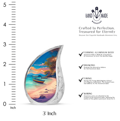 Navy Blue Beach Cremation Urn angled view of lid and engraved motif - flowing teardrop beach silhouette on curved aluminum - mini keepsake memorial for portion of cremation ashes