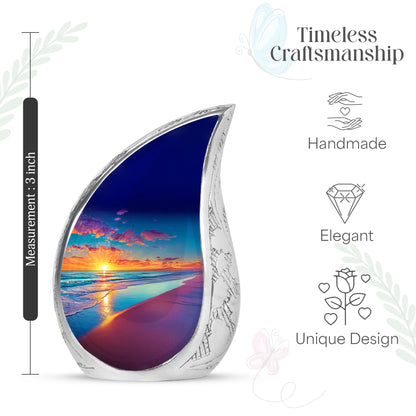 Sapphire Blue Beach Cremation Urn angled view of lid and engraved motif - graceful tear-shaped urn with beach motif - mini keepsake memorial for portion of cremation ashes