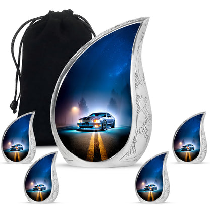 Misty Blue Car Cremation Urn side profile showing urn shape - flowing teardrop car silhouette on curved aluminum - memorial set with one large and four small urns