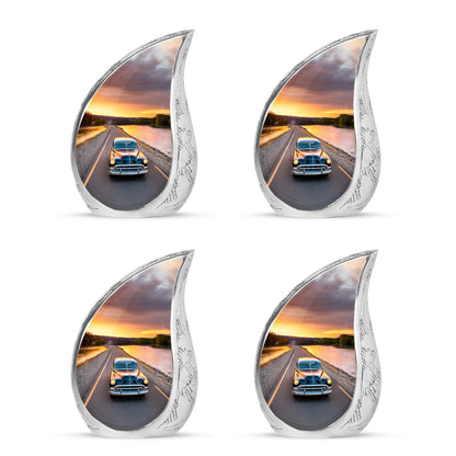 Soft Blue Car Cremation Urn close-up of engraving and surface detail - graceful tear-shaped urn with car motif - 10 inch aluminum urn for cremated remains