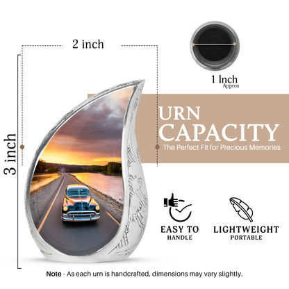Soft Blue Car Cremation Urn angled view of lid and engraved motif - smooth teardrop contour featuring car art - mini keepsake memorial for portion of cremation ashes