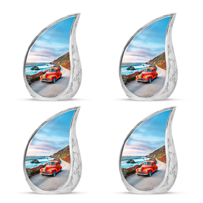 Soft Blue Car Cremation Urn close-up of engraving and surface detail - smooth teardrop contour featuring car art - 10 inch aluminum urn for cremated remains