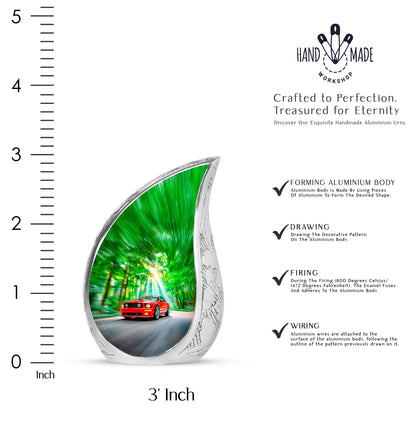 Forest Green Car Cremation Urn angled view of lid and engraved motif - graceful tear-shaped urn with car motif - mini keepsake memorial for portion of cremation ashes