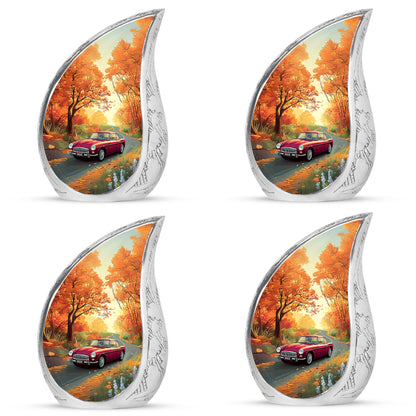 Warm Gold Car Cremation Urn close-up of engraving and surface detail - graceful tear-shaped urn with car motif - 10 inch aluminum urn for cremated remains