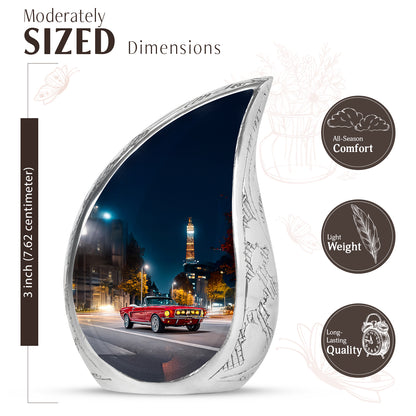 Sapphire Blue Car Cremation Urn angled view of lid and engraved motif - smooth teardrop contour featuring car art - mini keepsake memorial for portion of cremation ashes