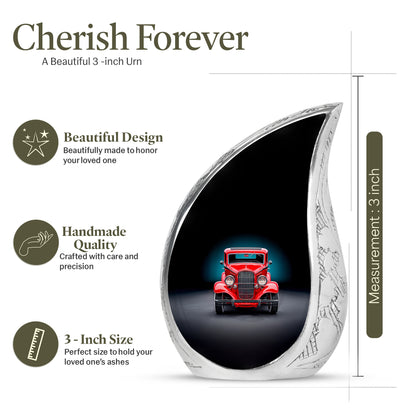 Glossy Black Car Cremation Urn angled view of lid and engraved motif - rounded teardrop car design with delicate detail - mini keepsake memorial for portion of cremation ashes