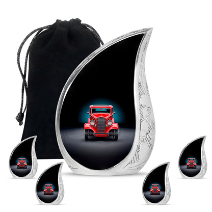 Jet Black Car Cremation Urn side profile showing urn shape - rounded teardrop car design with delicate detail - memorial set with one large and four small urns