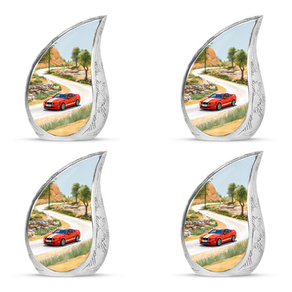 Gilded Gold Car Cremation Urn close-up of engraving and surface detail - rounded teardrop car design with delicate detail - 10 inch aluminum urn for cremated remains