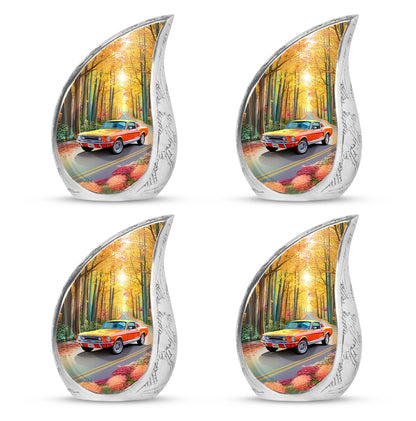 Burnished Gold Car Cremation Urn close-up of engraving and surface detail - graceful tear-shaped urn with car motif - 10 inch aluminum urn for cremated remains