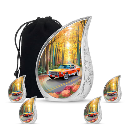 Sunrise Gold Car Cremation Urn side profile showing urn shape - rounded teardrop car design with delicate detail - memorial set with one large and four small urns