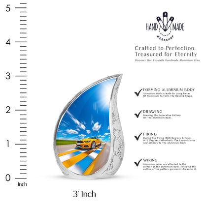 Bright Blue Car Cremation Urn angled view of lid and engraved motif - graceful tear-shaped urn with car motif - mini keepsake memorial for portion of cremation ashes