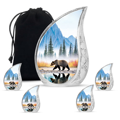 Sky Blue Bear Cremation Urn side profile showing urn shape - flowing teardrop bear silhouette on curved aluminum - memorial set with one large and four small urns
