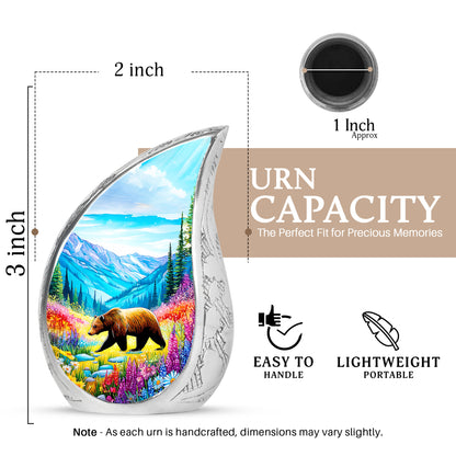 Ocean Teal Bear Cremation Urn angled view of lid and engraved motif - flowing teardrop bear silhouette on curved aluminum - mini keepsake memorial for portion of cremation ashes