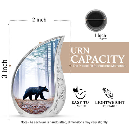 Soft Blue Bear Cremation Urn angled view of lid and engraved motif - smooth teardrop contour featuring bear art - mini keepsake memorial for portion of cremation ashes