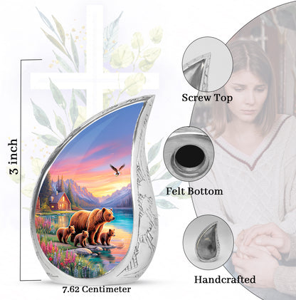 Sky Blue Bear Cremation Urn angled view of lid and engraved motif - flowing teardrop bear silhouette on curved aluminum - mini keepsake memorial for portion of cremation ashes