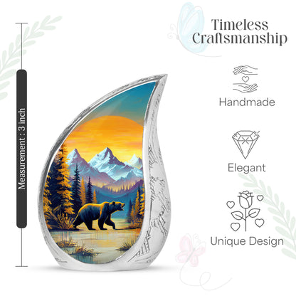 Warm Gold Bear Cremation Urn angled view of lid and engraved motif - smooth teardrop contour featuring bear art - mini keepsake memorial for portion of cremation ashes