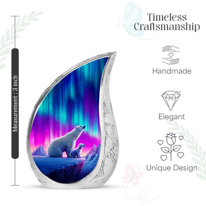 Icy Blue Bear Cremation Urn angled view of lid and engraved motif - flowing teardrop bear silhouette on curved aluminum - mini keepsake memorial for portion of cremation ashes