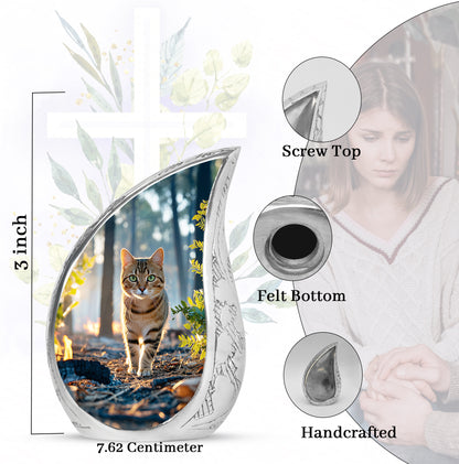 Icy Blue Cat Cremation Urn angled view of lid and engraved motif - rounded teardrop cat design with delicate detail - mini keepsake memorial for portion of cremation ashes