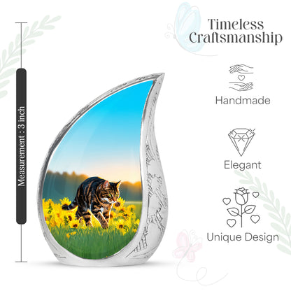 Mystic Teal Cat Cremation Urn angled view of lid and engraved motif - graceful tear-shaped urn with cat motif - mini keepsake memorial for portion of cremation ashes
