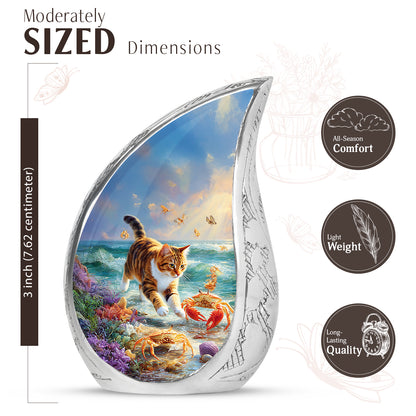 Icy Blue Cat Cremation Urn angled view of lid and engraved motif - rounded teardrop cat design with delicate detail - mini keepsake memorial for portion of cremation ashes
