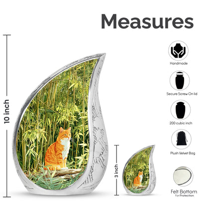 Sage Green Cat Cremation Urn angled view of lid and engraved motif - flowing teardrop cat silhouette on curved aluminum - mini keepsake memorial for portion of cremation ashes