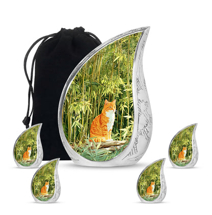 Moss Green Cat Cremation Urn side profile showing urn shape - rounded teardrop cat design with delicate detail - memorial set with one large and four small urns