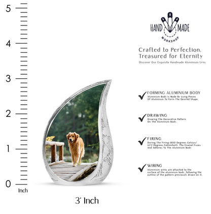 Forest Green Dog Cremation Urn angled view of lid and engraved motif - smooth teardrop contour featuring dog art - mini keepsake memorial for portion of cremation ashes