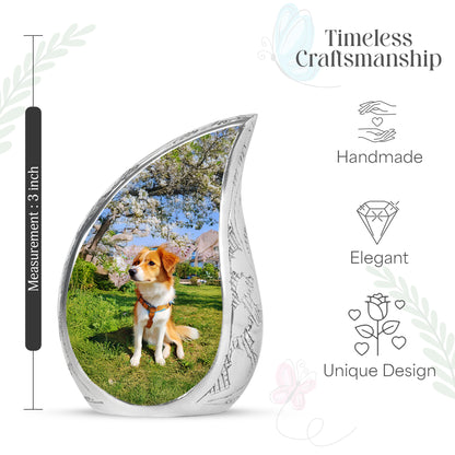 Soft Blue Dog Cremation Urn angled view of lid and engraved motif - smooth teardrop contour featuring dog art - mini keepsake memorial for portion of cremation ashes