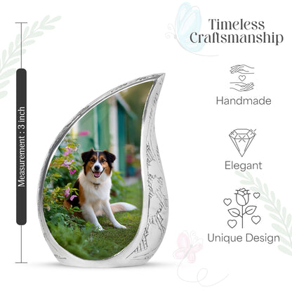 Mint Green Dog Cremation Urn angled view of lid and engraved motif - graceful tear-shaped urn with dog motif - mini keepsake memorial for portion of cremation ashes