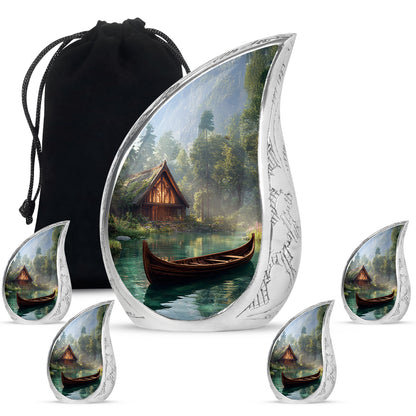 Ebony Boat Cremation Urn side profile showing urn shape - rounded teardrop boat design with delicate detail - memorial set with one large and four small urns