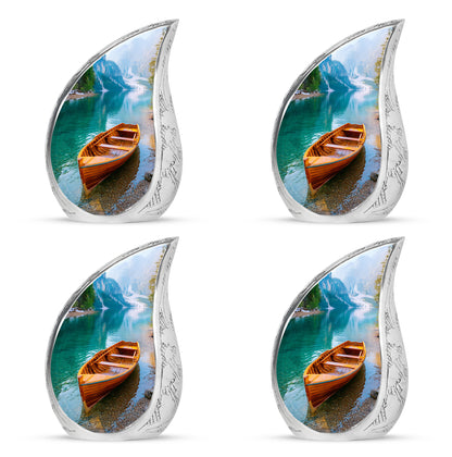 Soft Teal Boat Cremation Urn close-up of engraving and surface detail - flowing teardrop boat silhouette on curved aluminum - 10 inch aluminum urn for cremated remains