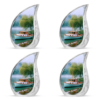 Vivid Teal Boat Cremation Urn close-up of engraving and surface detail - smooth teardrop contour featuring boat art - 10 inch aluminum urn for cremated remains