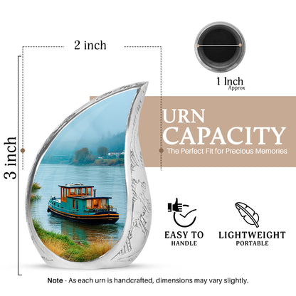 Jewel Teal Boat Cremation Urn angled view of lid and engraved motif - flowing teardrop boat silhouette on curved aluminum - mini keepsake memorial for portion of cremation ashes