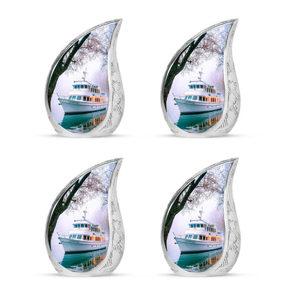 Ivory White Boat Cremation Urn close-up of engraving and surface detail - rounded teardrop boat design with delicate detail - 10 inch aluminum urn for cremated remains