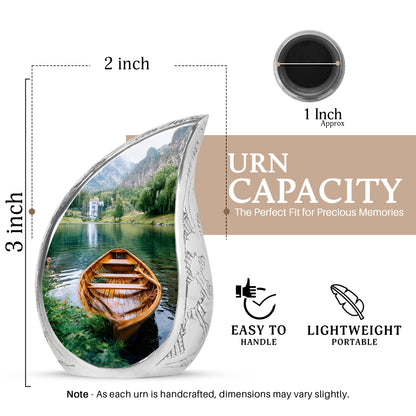 Olive Green Boat Cremation Urn angled view of lid and engraved motif - graceful tear-shaped urn with boat motif - mini keepsake memorial for portion of cremation ashes