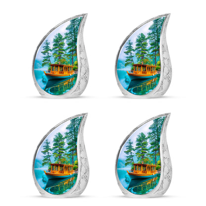 Deep Teal Boat Cremation Urn close-up of engraving and surface detail - graceful tear-shaped urn with boat motif - 10 inch aluminum urn for cremated remains