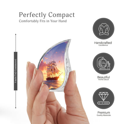 Sky Blue Boat Cremation Urn angled view of lid and engraved motif - rounded teardrop boat design with delicate detail - mini keepsake memorial for portion of cremation ashes
