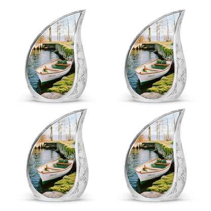 Marigold Yellow Boat Cremation Urn close-up of engraving and surface detail - smooth teardrop contour featuring boat art - 10 inch aluminum urn for cremated remains