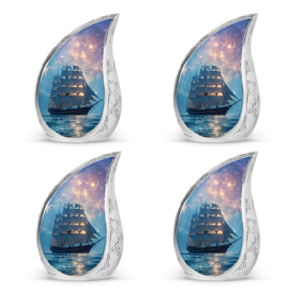 Royal Blue Boat Cremation Urn close-up of engraving and surface detail - smooth teardrop contour featuring boat art - 10 inch aluminum urn for cremated remains