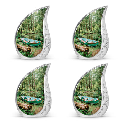Emerald Green Boat Cremation Urn close-up of engraving and surface detail - flowing teardrop boat silhouette on curved aluminum - 10 inch aluminum urn for cremated remains