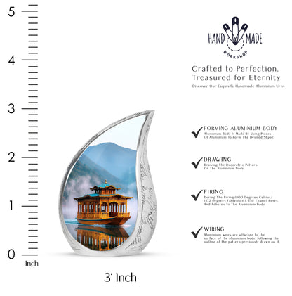 Vivid Blue Boat Cremation Urn angled view of lid and engraved motif - smooth teardrop contour featuring boat art - mini keepsake memorial for portion of cremation ashes