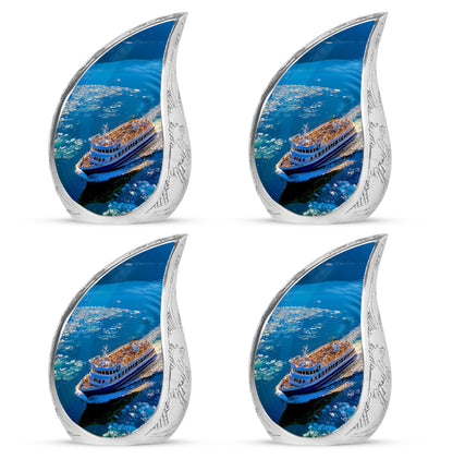 Vivid Blue Boat Cremation Urn close-up of engraving and surface detail - smooth teardrop contour featuring boat art - 10 inch aluminum urn for cremated remains