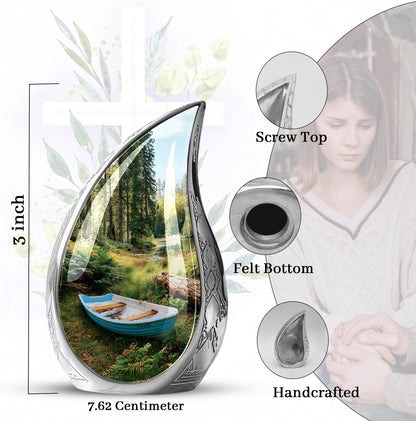 Midnight Black Boat Cremation Urn angled view of lid and engraved motif - graceful tear-shaped urn with boat motif - mini keepsake memorial for portion of cremation ashes