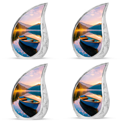 Vivid Teal Boat Cremation Urn close-up of engraving and surface detail - graceful tear-shaped urn with boat motif - 10 inch aluminum urn for cremated remains