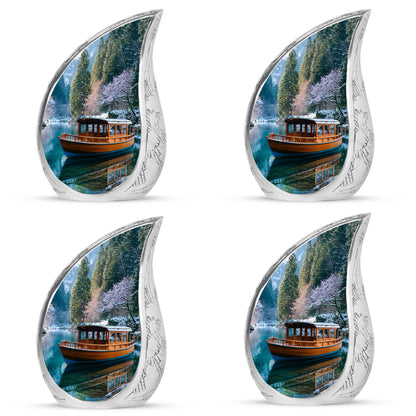 Misty Blue Boat Cremation Urn close-up of engraving and surface detail - flowing teardrop boat silhouette on curved aluminum - 10 inch aluminum urn for cremated remains