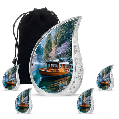 Vivid Blue Boat Cremation Urn side profile showing urn shape - smooth teardrop contour featuring boat art - memorial set with one large and four small urns
