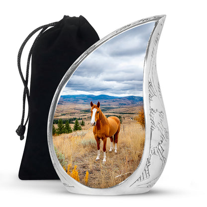 Azure Horse Cremation Urn front view showing detailed design - flowing teardrop horse silhouette on curved aluminum - full-size 10 inch 200 cubic inch adult cremation urn