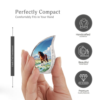 Soft Blue Horse Cremation Urn angled view of lid and engraved motif - smooth teardrop contour featuring horse art - mini keepsake memorial for portion of cremation ashes